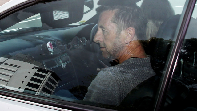 TAURANGA, NEW ZEALAND - NOVEMBER 06:  AC/DC drummer Phil Rudd leaves Tauranga District Court  after being charged with attempting to procure murder at Tauranga District Court on November 6, 2014 in Tauranga, New Zealand.  Phil Rudd was AC/DC's drummer from 1975 to 1983.  (Photo by Joel Ford/Getty Images)
